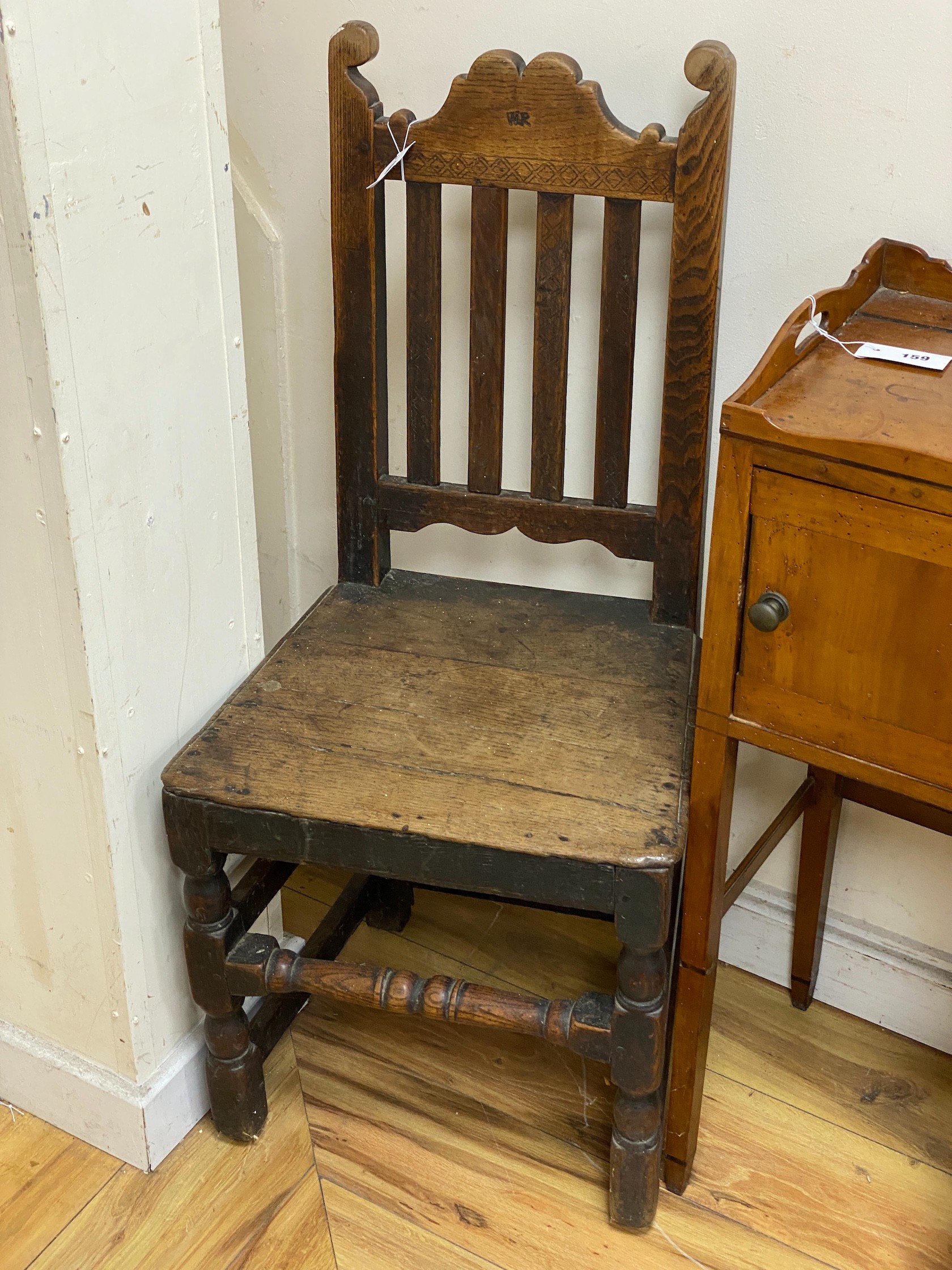 A near pair of 18th century wood seat chairs, larger width 45cm, height 101cm